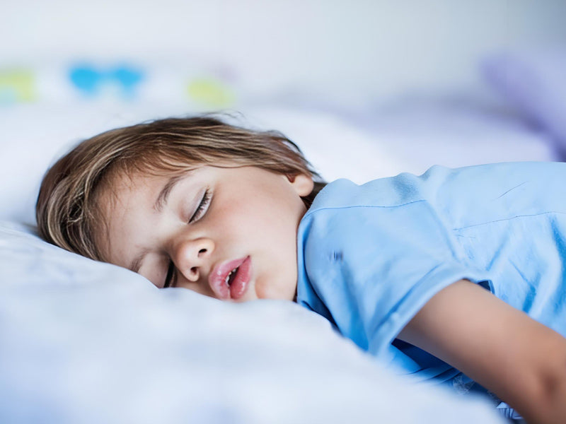 a sleeping little boy